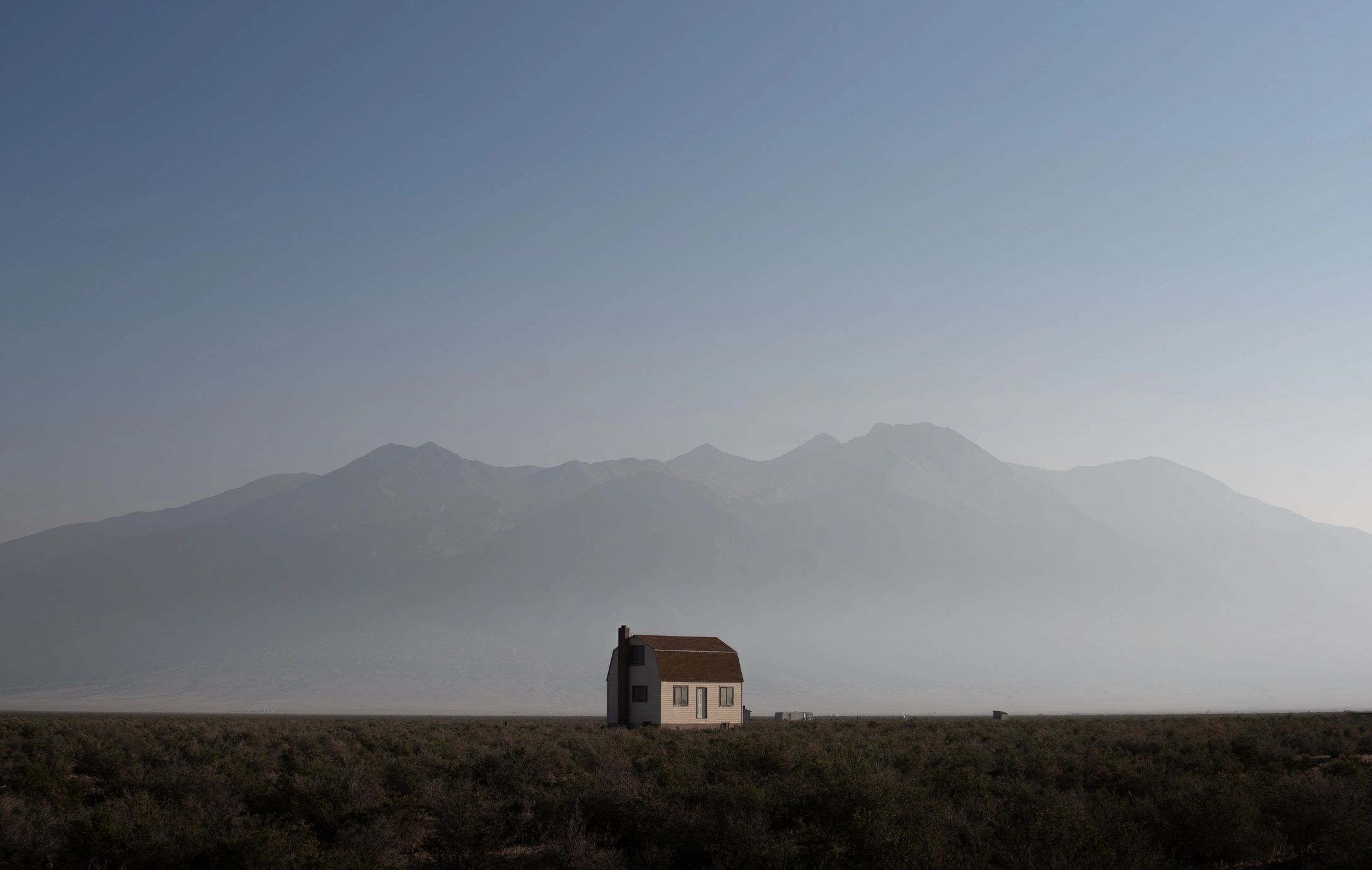 Countryside home with mountain backdrop